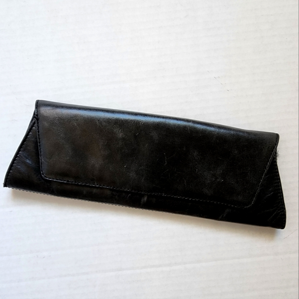 Black leather clutch in trapazoid shape